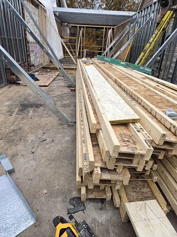 Framing lumber steel studs staged on site