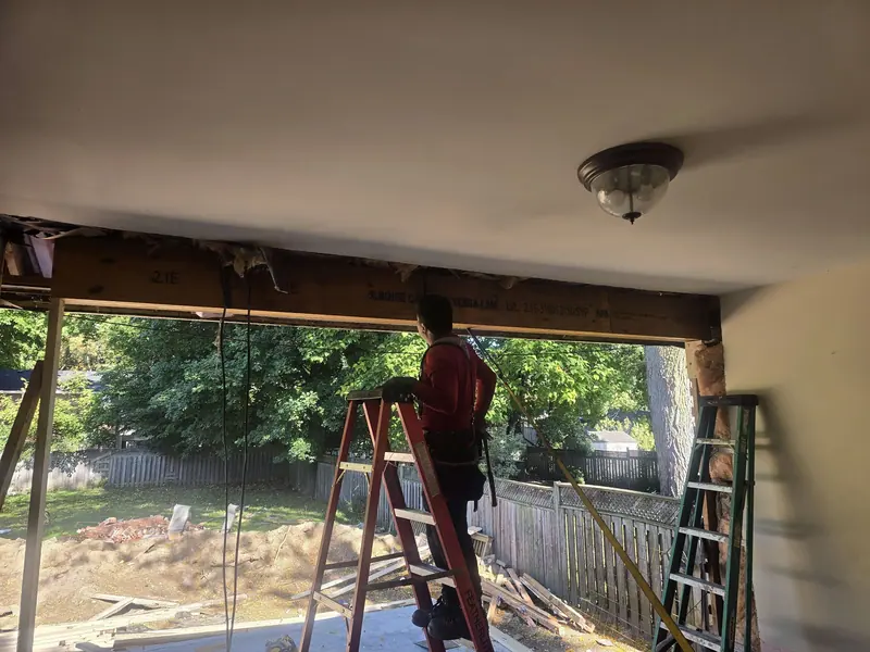 Load bearing wall opening beam installation