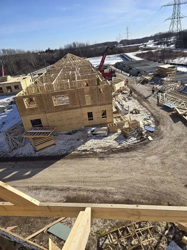 New home framing aerial winter site