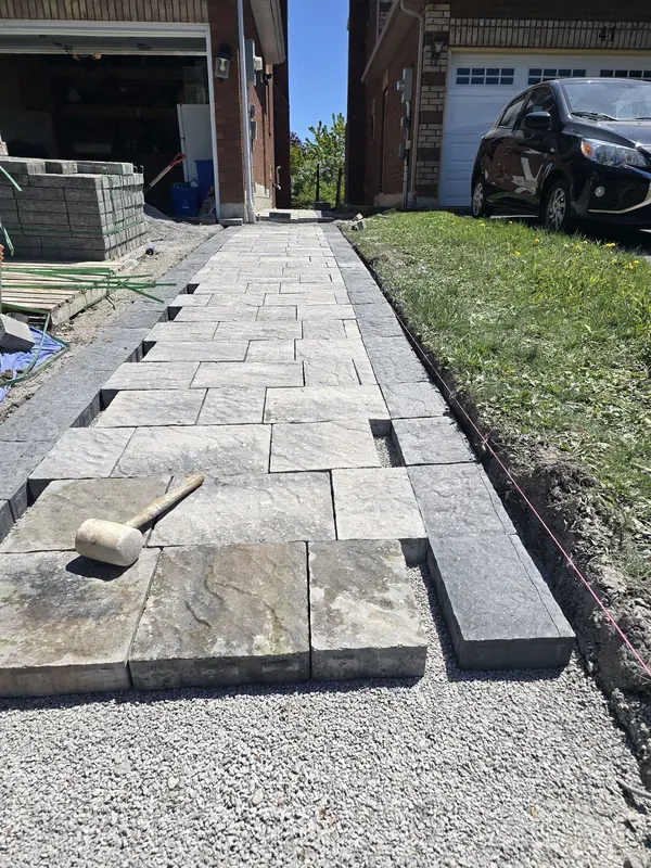 Paver walkway installation driveway side