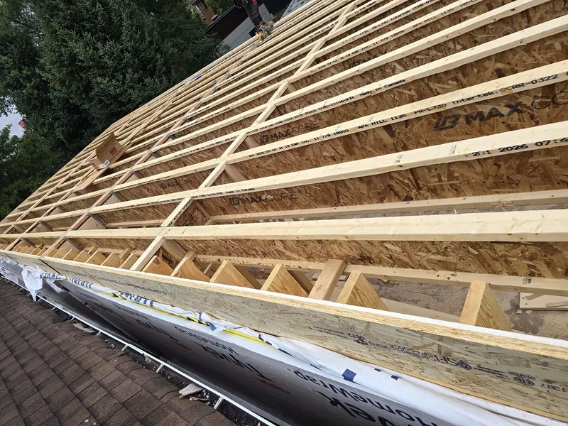 Roof framing joists over existing shingle roof