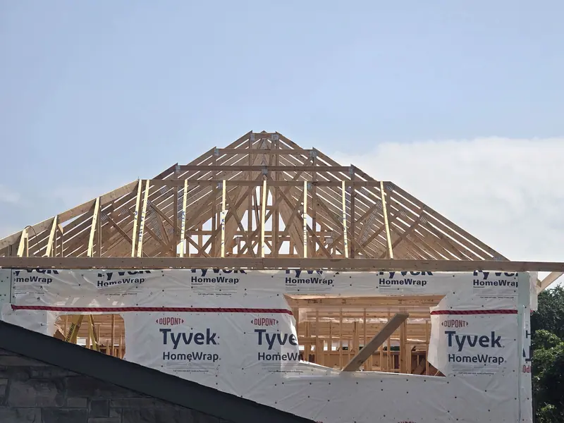 Roof trusses installed tyvek wrapped home