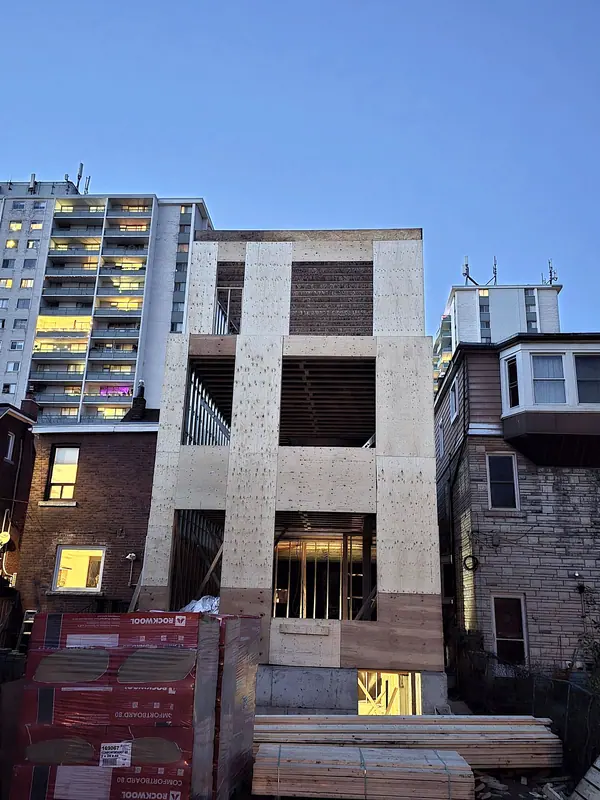 Three storey infill home sheathing dusk