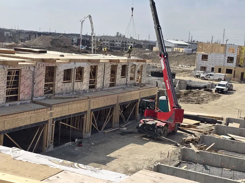 Townhomes framing crane construction site