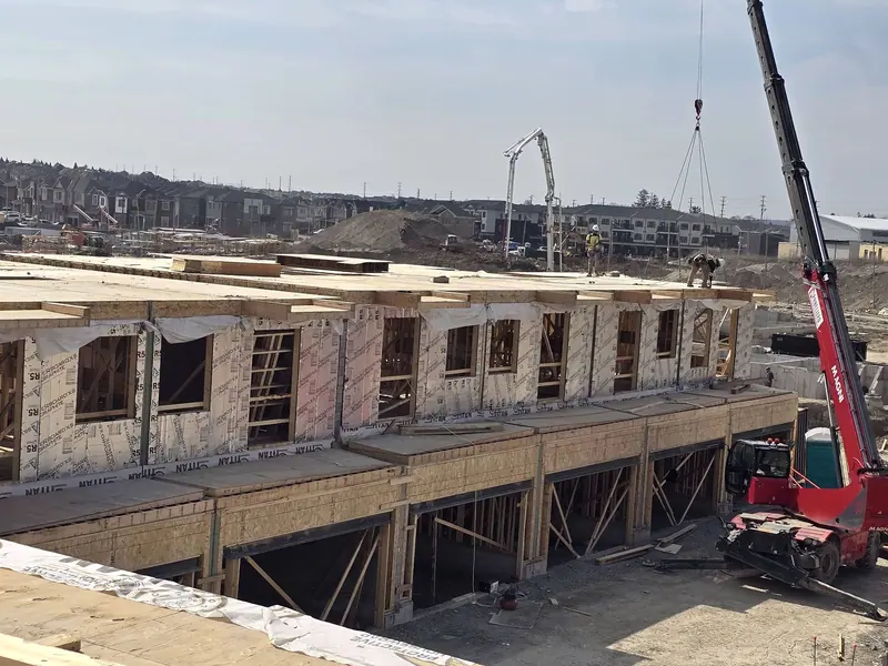 Townhouse framing crane roof trusses